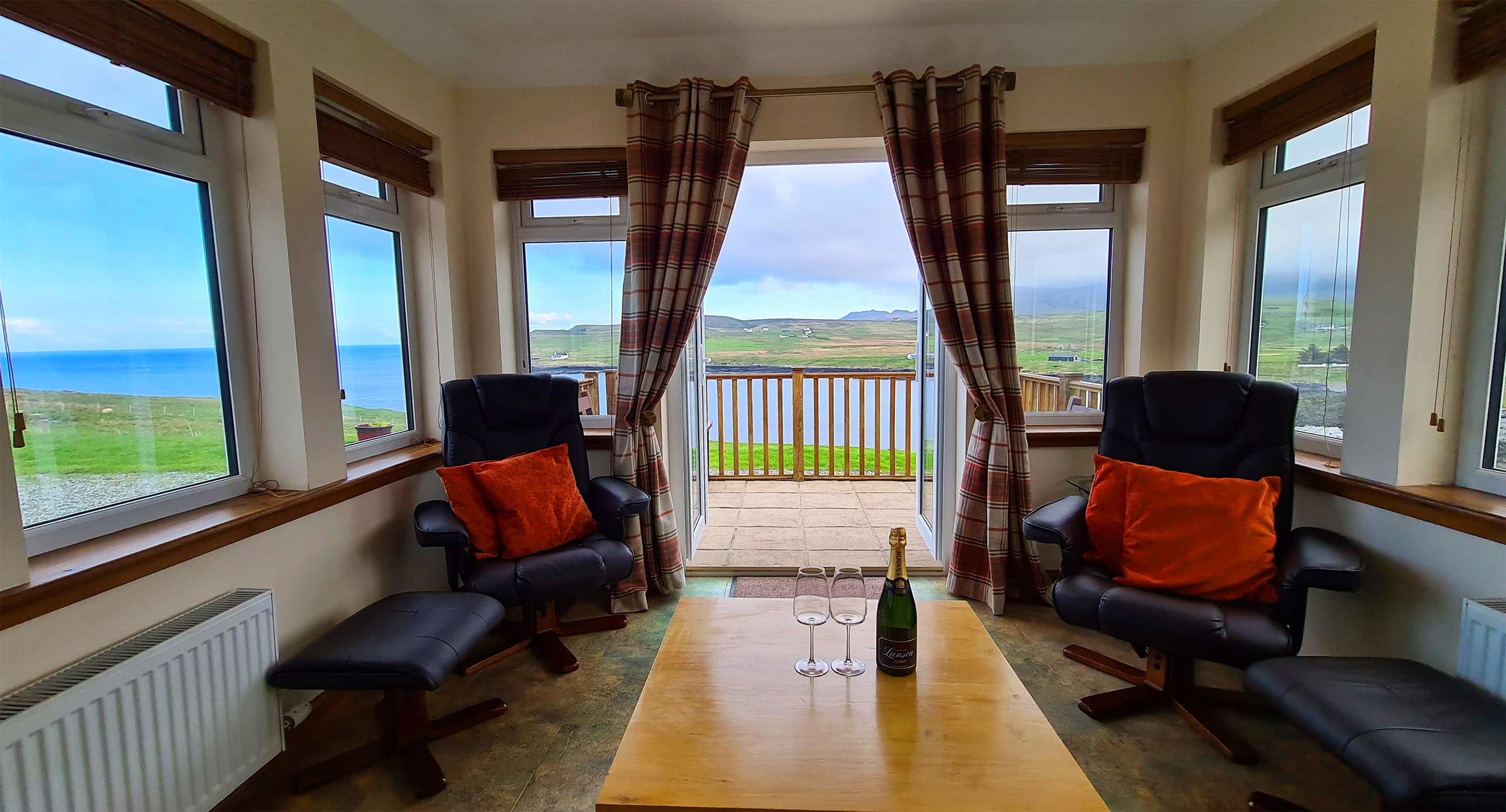 Relax and unwind in Aird Cottage sea view sun lounge with sea views